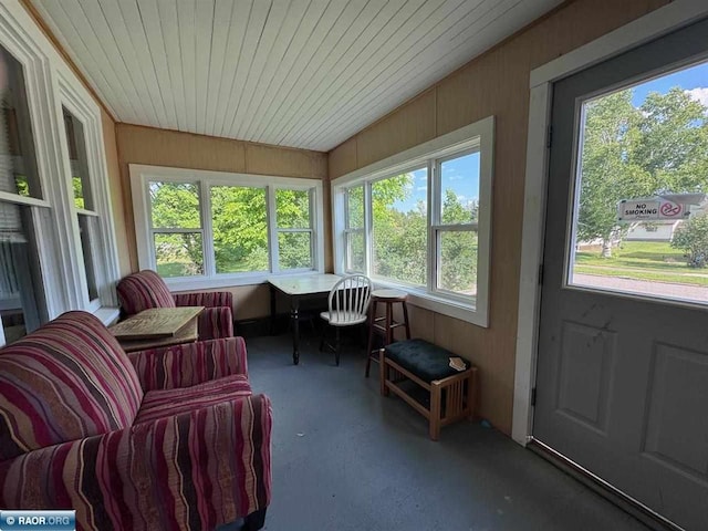 1027 Chapman St, Ely, MN 55731 - sunroom with carpet, wood walls, and wooden ceiling