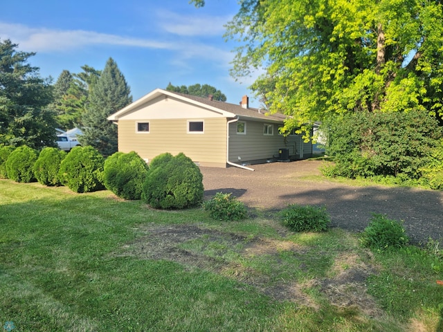 327 Mickey Mouse Ave, Horace, ND 58047 - view of side of property with a chimney and a lawn