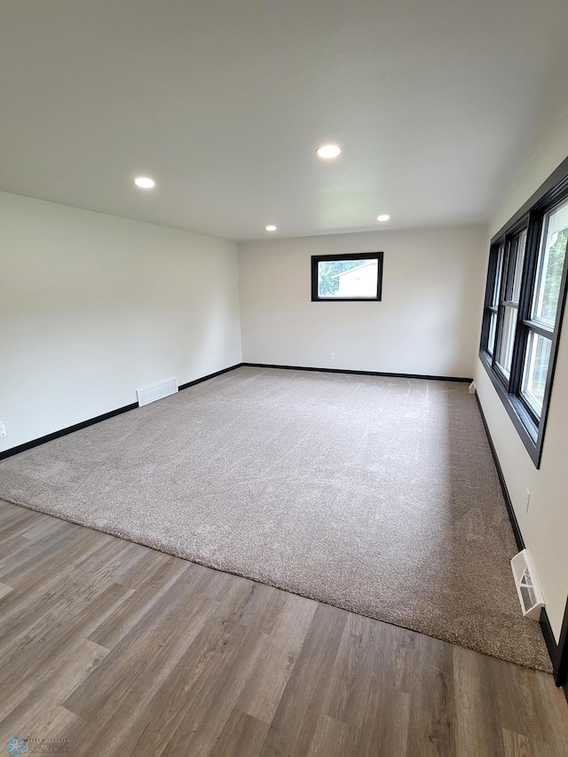 327 Mickey Mouse Ave, Horace, ND 58047 - empty room with recessed lighting and wood finished floors