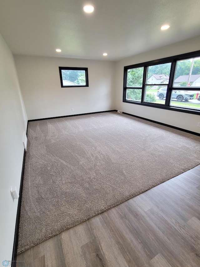 327 Mickey Mouse Ave, Horace, ND 58047 - empty room featuring healthy amount of natural light, recessed lighting, and wood finished floors
