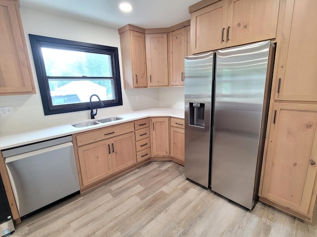 327 Mickey Mouse Ave, Horace, ND 58047 - kitchen featuring light brown cabinetry, appliances with stainless steel finishes, light wood finished floors, and light countertops