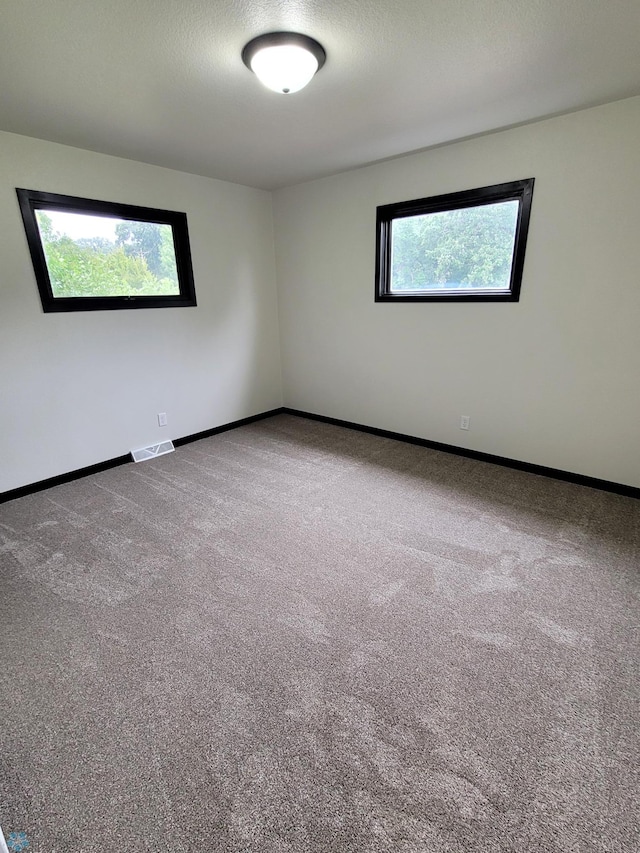 327 Mickey Mouse Ave, Horace, ND 58047 - empty room featuring carpet flooring and baseboards