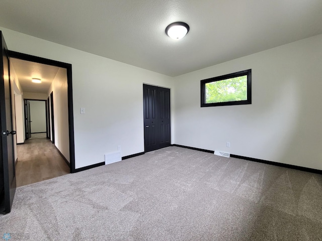 327 Mickey Mouse Ave, Horace, ND 58047 - unfurnished bedroom with carpet and a closet