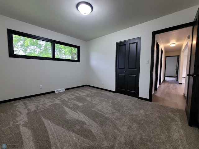 327 Mickey Mouse Ave, Horace, ND 58047 - unfurnished bedroom with carpet and baseboards