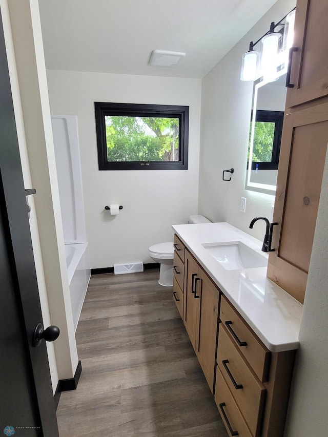 327 Mickey Mouse Ave, Horace, ND 58047 - bathroom with vanity and wood finished floors