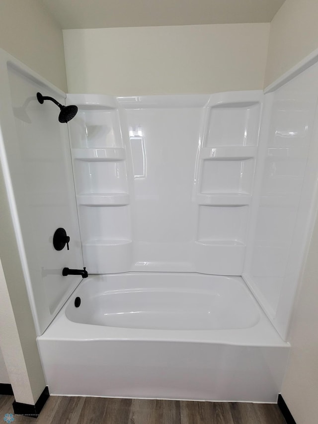 327 Mickey Mouse Ave, Horace, ND 58047 - full bathroom with wood finished floors and shower / tub combination
