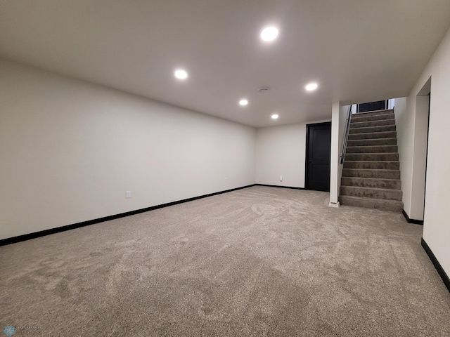 327 Mickey Mouse Ave, Horace, ND 58047 - finished below grade area with light colored carpet, stairway, and recessed lighting