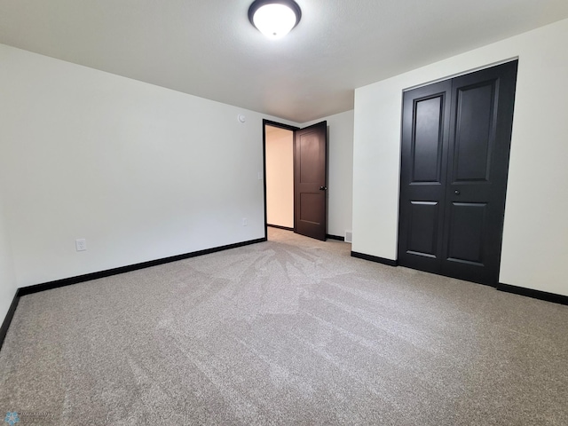 327 Mickey Mouse Ave, Horace, ND 58047 - unfurnished bedroom featuring light colored carpet and a closet