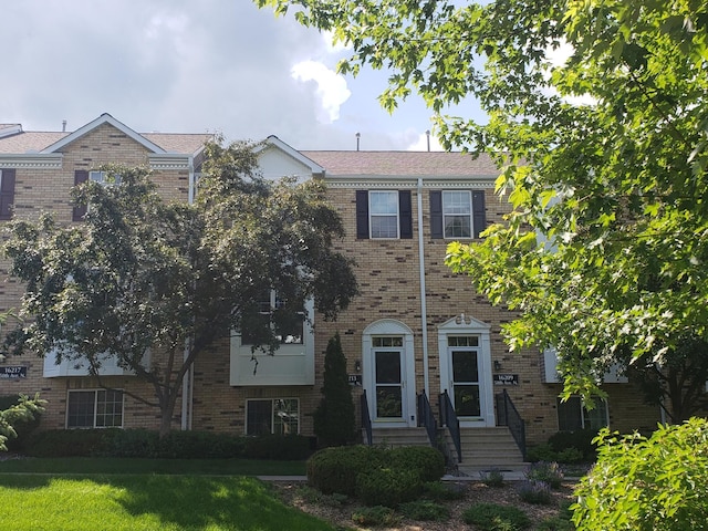 16213 50th Ave N, Plymouth, MN 55446 - colonial inspired home featuring entry steps, brick siding, and a front yard