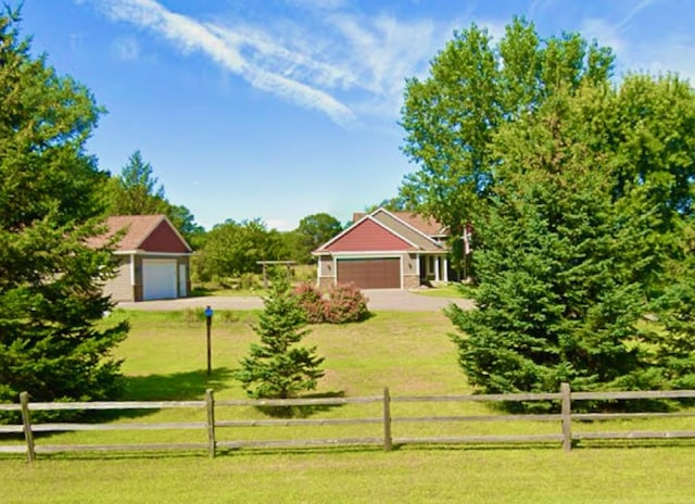 22174 Palisade St NE, East Bethel, MN 55011 - view of yard featuring a garage