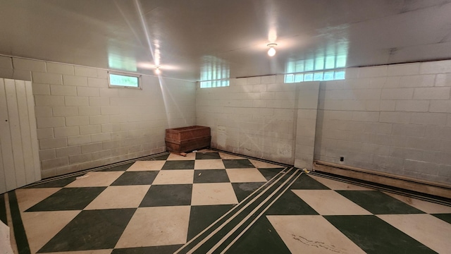 211 2nd St, Hatfield, MN 56164 - below grade area with a baseboard heating unit and tile patterned floors