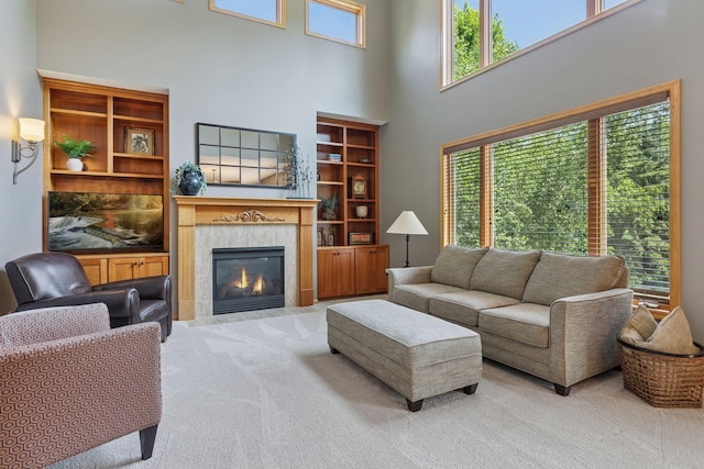 13836 Clare Downs Way, Rosemount, MN 55068 - living area featuring carpet flooring, a tile fireplace, and a high ceiling