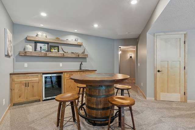 13836 Clare Downs Way, Rosemount, MN 55068 - indoor wet bar featuring wine cooler, light colored carpet, and recessed lighting