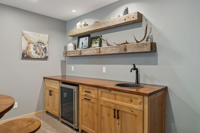 13836 Clare Downs Way, Rosemount, MN 55068 - indoor bar with wine cooler, light carpet, and recessed lighting