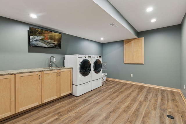 13836 Clare Downs Way, Rosemount, MN 55068 - washroom with washer and clothes dryer, cabinet space, light wood-type flooring, and recessed lighting
