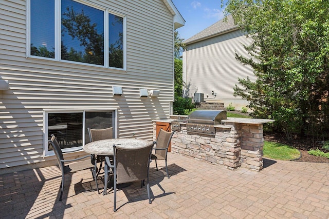 13836 Clare Downs Way, Rosemount, MN 55068 - view of patio / terrace with exterior kitchen and outdoor dining area