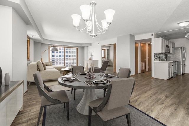66 9th St E Unit 2315, Saint Paul, MN 55101 - dining area with dark wood-type flooring and a chandelier