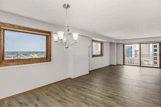 66 9th St E Unit 2315, Saint Paul, MN 55101 - empty room with a chandelier and wood finished floors