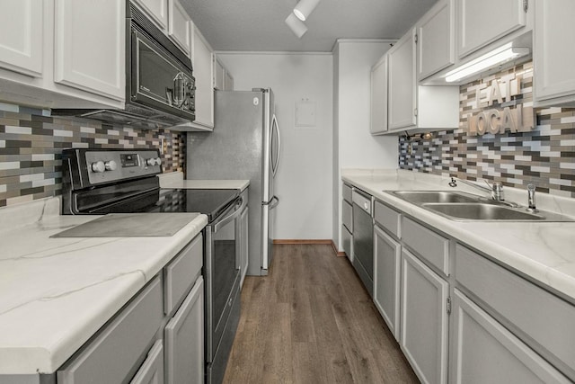 66 9th St E Unit 2315, Saint Paul, MN 55101 - kitchen featuring appliances with stainless steel finishes, dark wood finished floors, tasteful backsplash, and white cabinetry