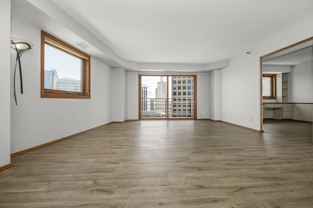 66 9th St E Unit 2315, Saint Paul, MN 55101 - unfurnished room featuring plenty of natural light and wood finished floors