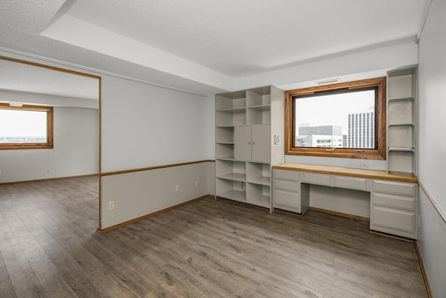 66 9th St E Unit 2315, Saint Paul, MN 55101 - unfurnished office with built in study area and wood finished floors