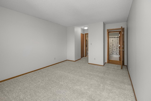66 9th St E Unit 2315, Saint Paul, MN 55101 - spare room featuring light carpet and a textured ceiling