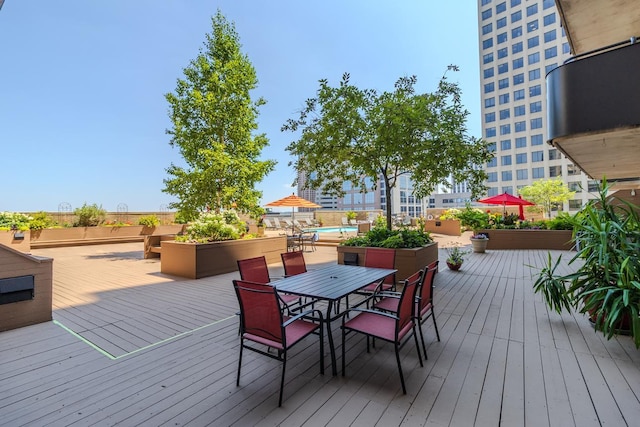 66 9th St E Unit 2315, Saint Paul, MN 55101 - wooden deck featuring outdoor dining area
