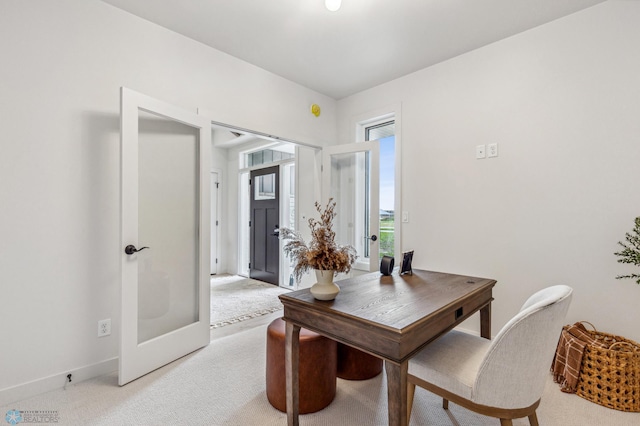 5820 31st St S, Fargo, ND 58104 - dining space with light colored carpet, an office area, and french doors