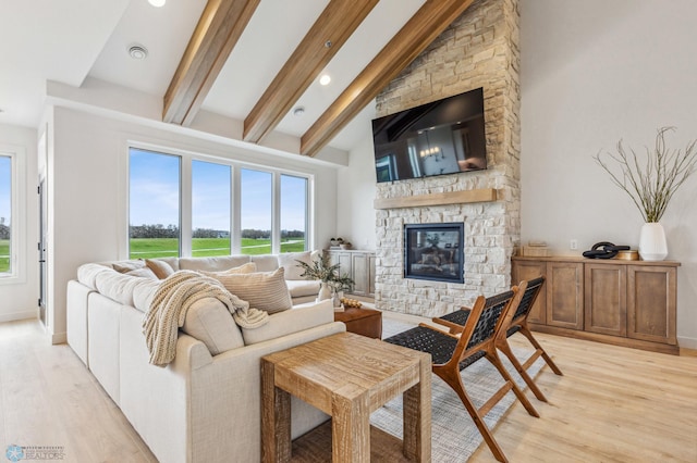 5820 31st St S, Fargo, ND 58104 - living area with light wood-style floors, plenty of natural light, a stone fireplace, and recessed lighting