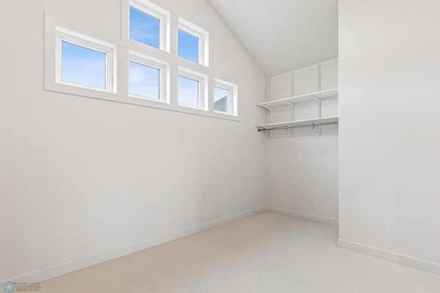 5820 31st St S, Fargo, ND 58104 - walk in closet featuring light colored carpet and vaulted ceiling