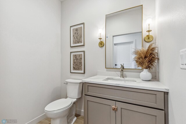 5820 31st St S, Fargo, ND 58104 - half bath featuring vanity and wood finished floors