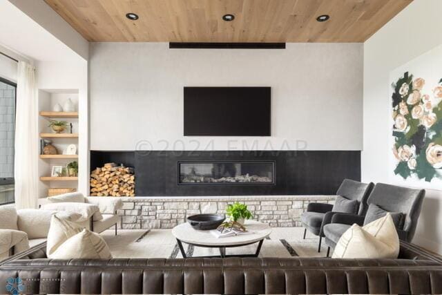 living room featuring built in shelves and wood ceiling