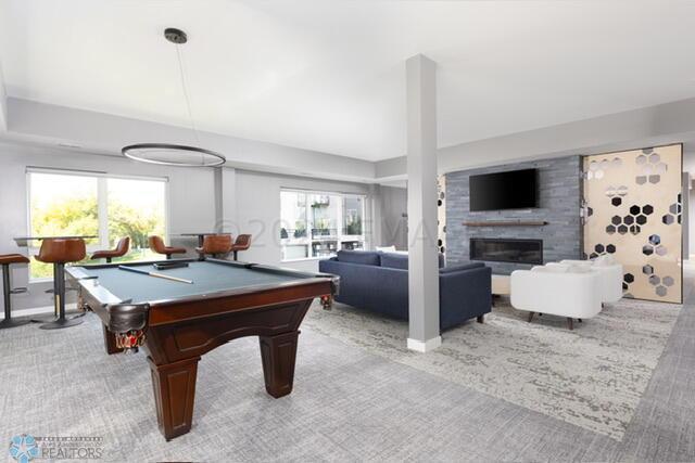 recreation room featuring a fireplace and billiards