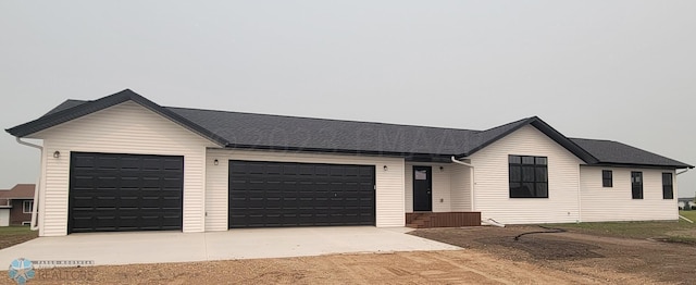 single story home featuring a garage