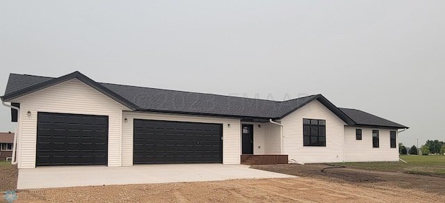 single story home with a garage