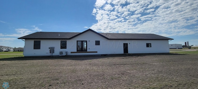 rear view of property with french doors