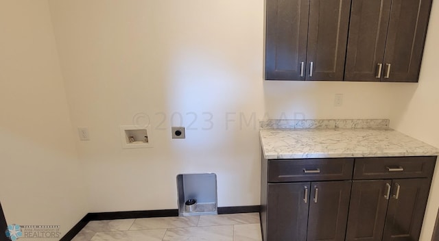 clothes washing area featuring hookup for a washing machine, cabinets, and hookup for an electric dryer