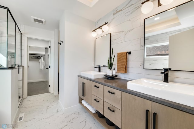 bathroom featuring vanity and a shower with shower door