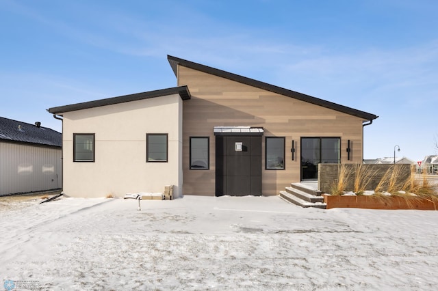 view of snow covered house