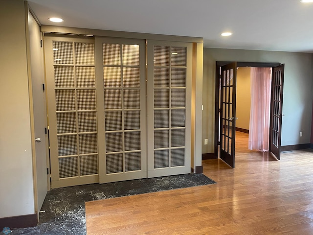 doorway to outside featuring french doors and wood-type flooring