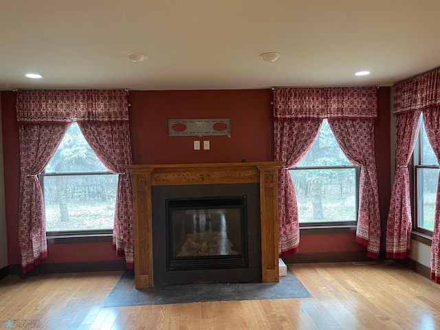 unfurnished living room with hardwood / wood-style floors