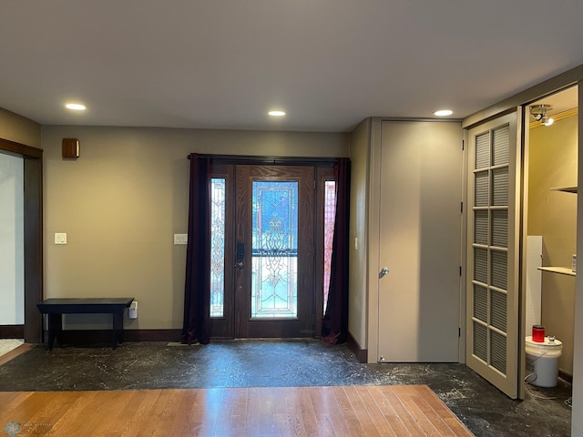 entryway with hardwood / wood-style flooring