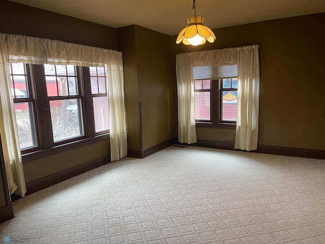 unfurnished room with light carpet