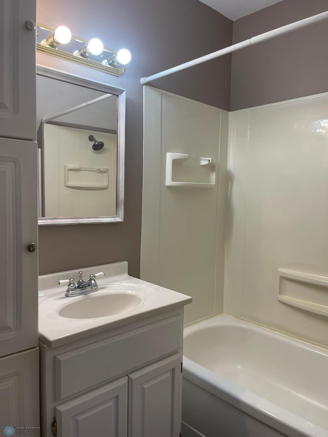 bathroom featuring vanity and tub / shower combination