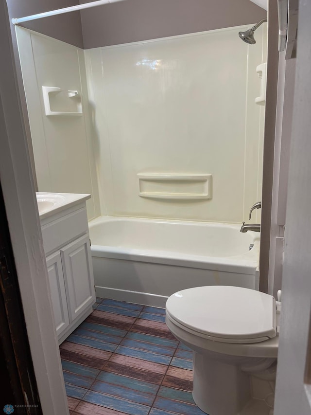 full bathroom with toilet, vanity, shower / washtub combination, and tile floors