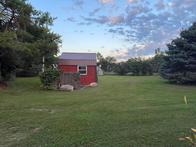 yard at dusk with an outdoor structure