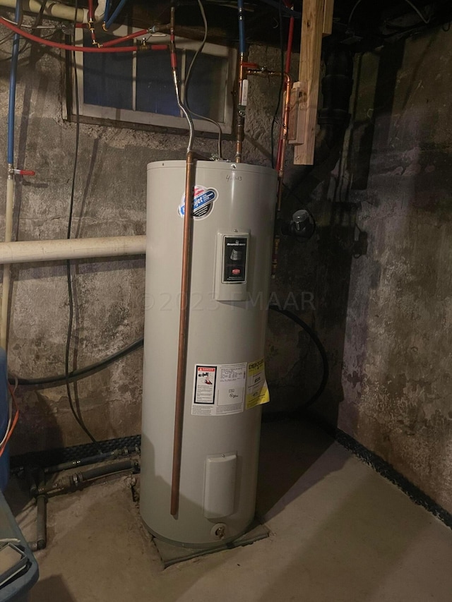 utility room featuring electric water heater