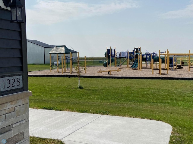 view of playground with a yard