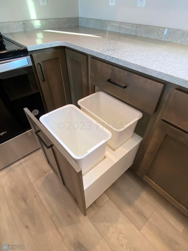 details with dark brown cabinetry and stove