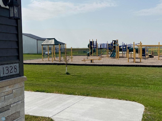community play area with a yard